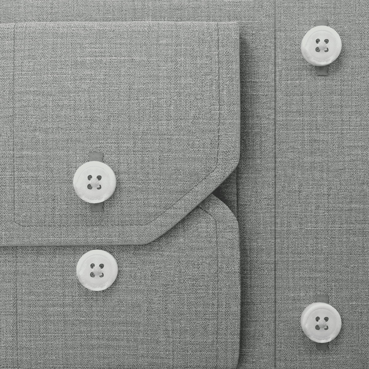 A close up rendering of a cuff resting on a shirt base, with buttons in various positions