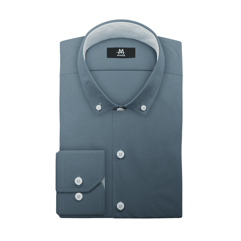 A rendering of the previously seen dress shirt's component stacked on top of each other with a generic drop shadow applied to each